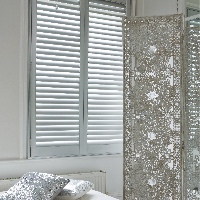 Create a beautiful living space with stylish shutters