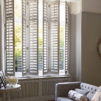Full Height Vinyl Shutters by Luxaflex supplied by Harmony